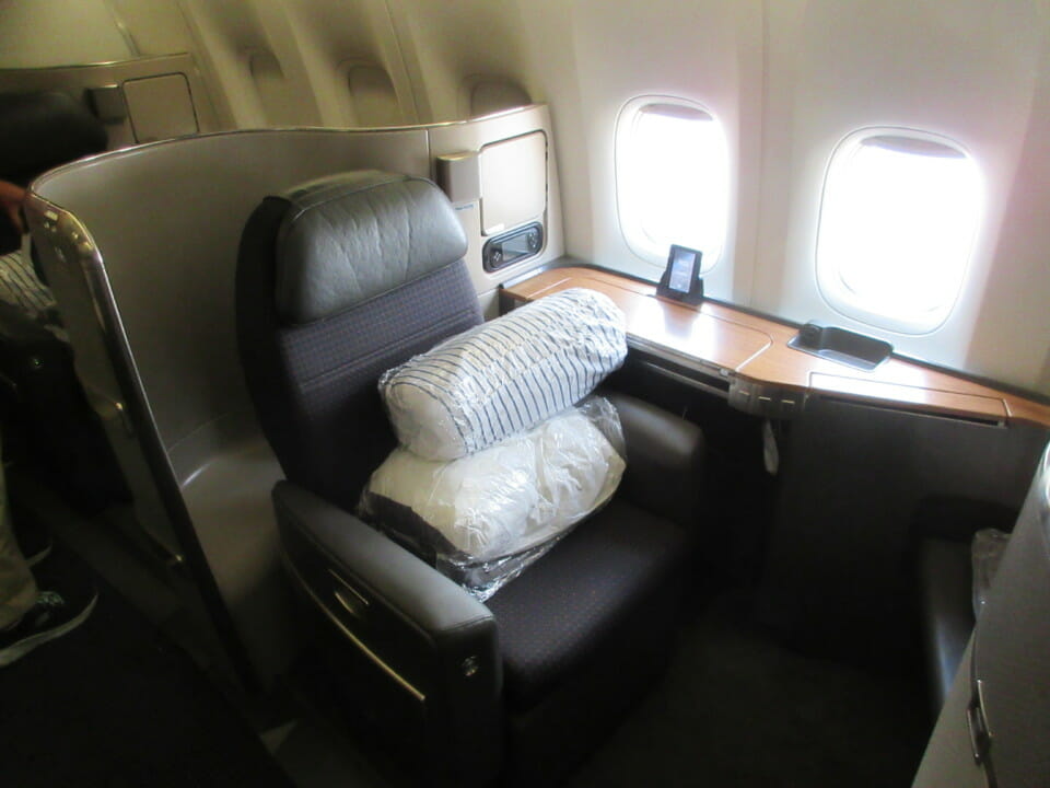 a seat with pillows on it