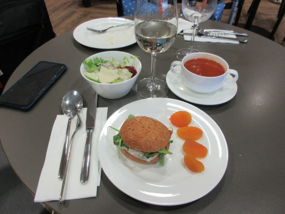 a plate of food and a bowl of soup on a table