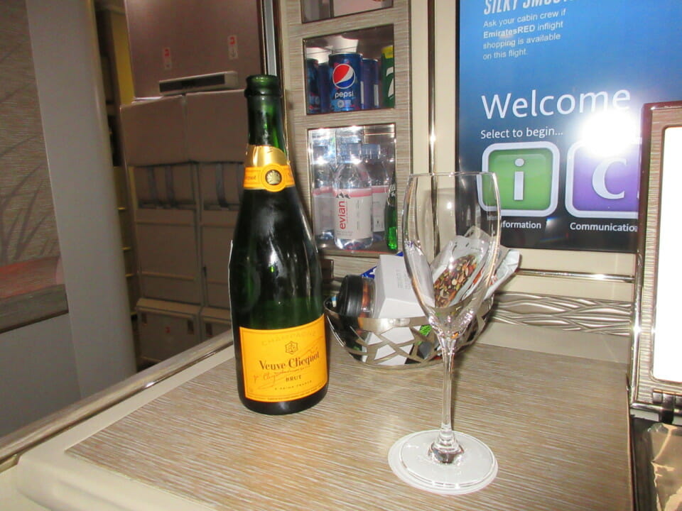 a bottle of champagne and a glass on a table