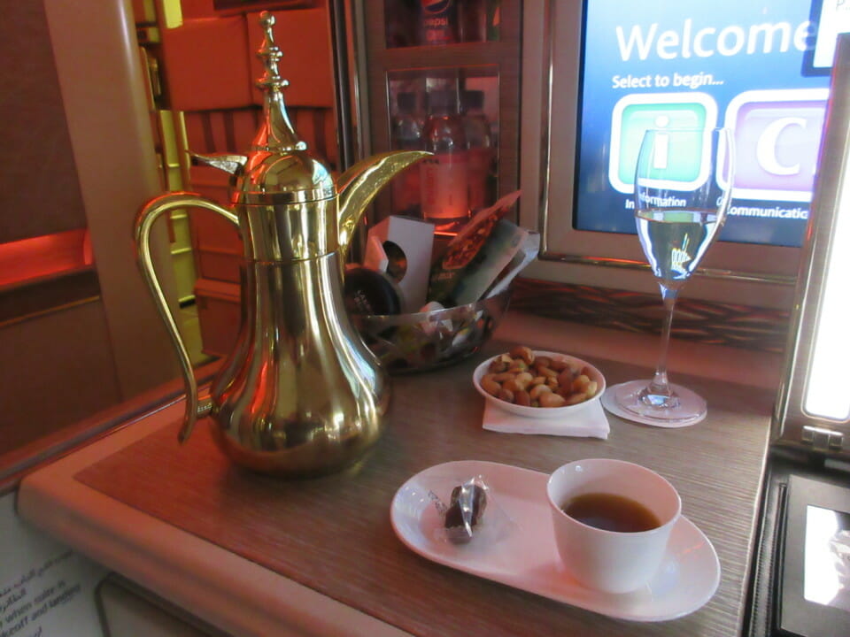a coffee pot and two cups of tea