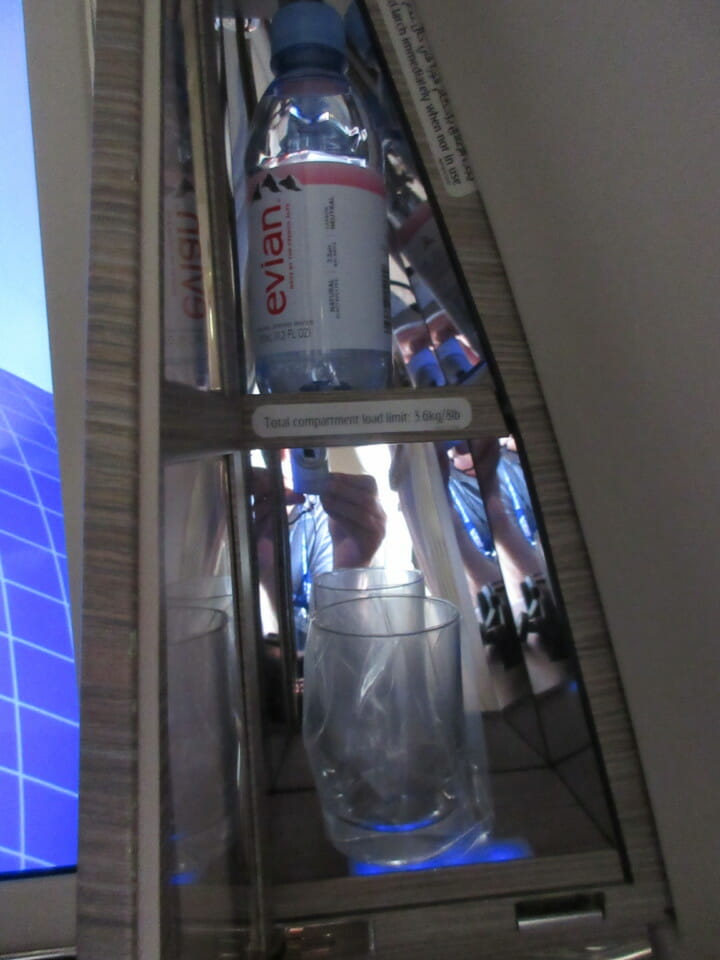 a bottle and a glass on a ladder