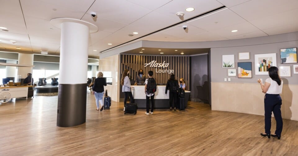 a group of people standing at a reception desk
