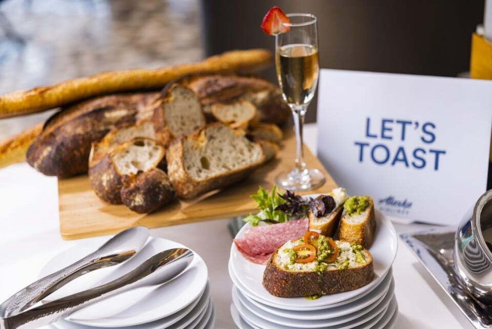 a plate of food and a glass of champagne