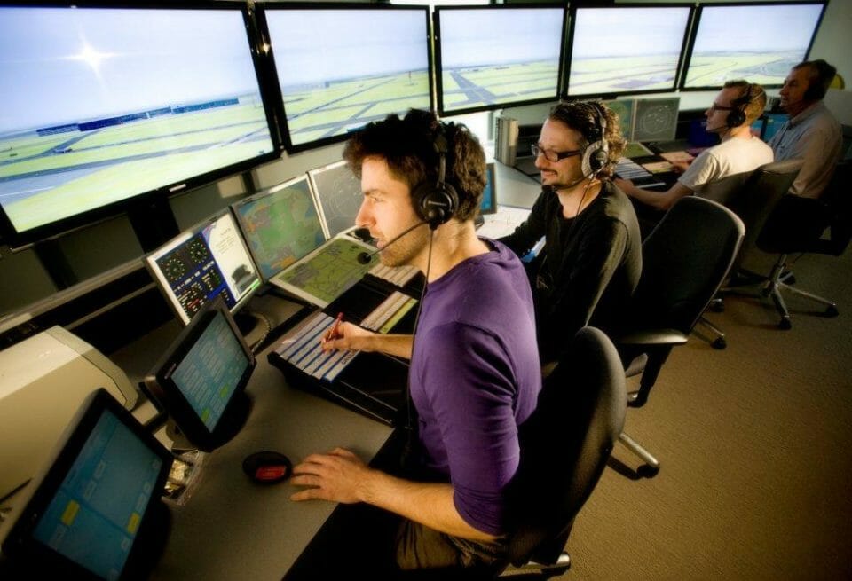a group of men working on computers