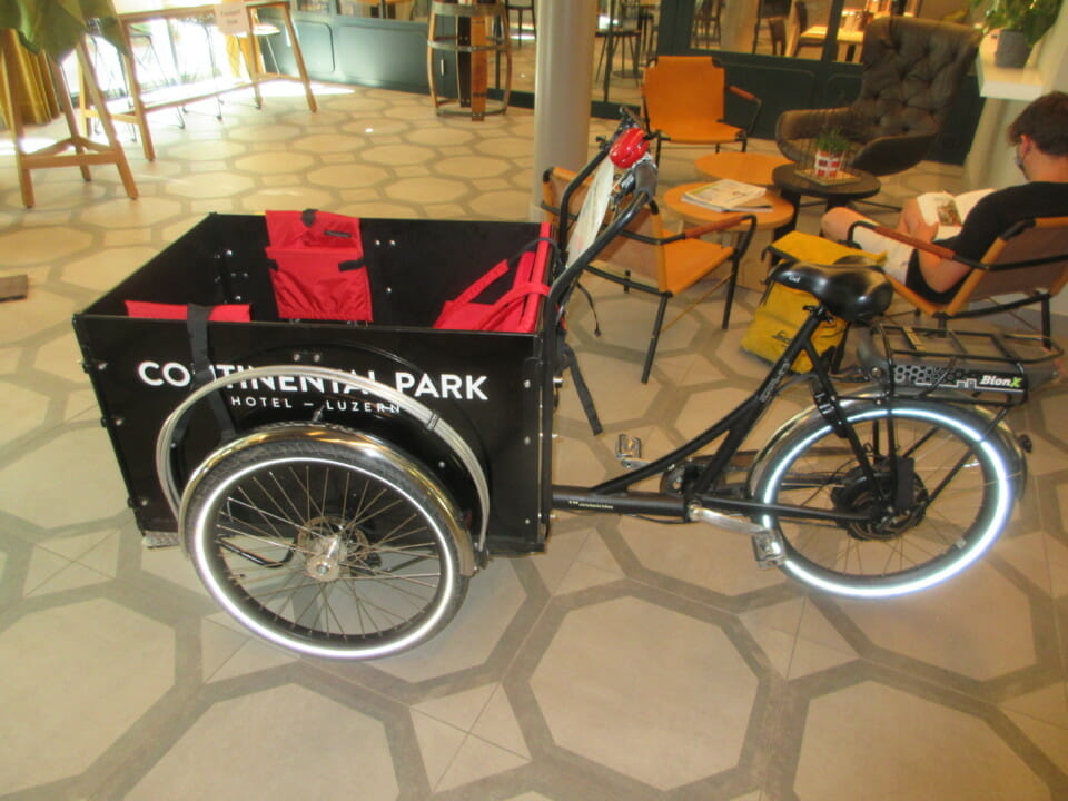 a black bicycle with a cart