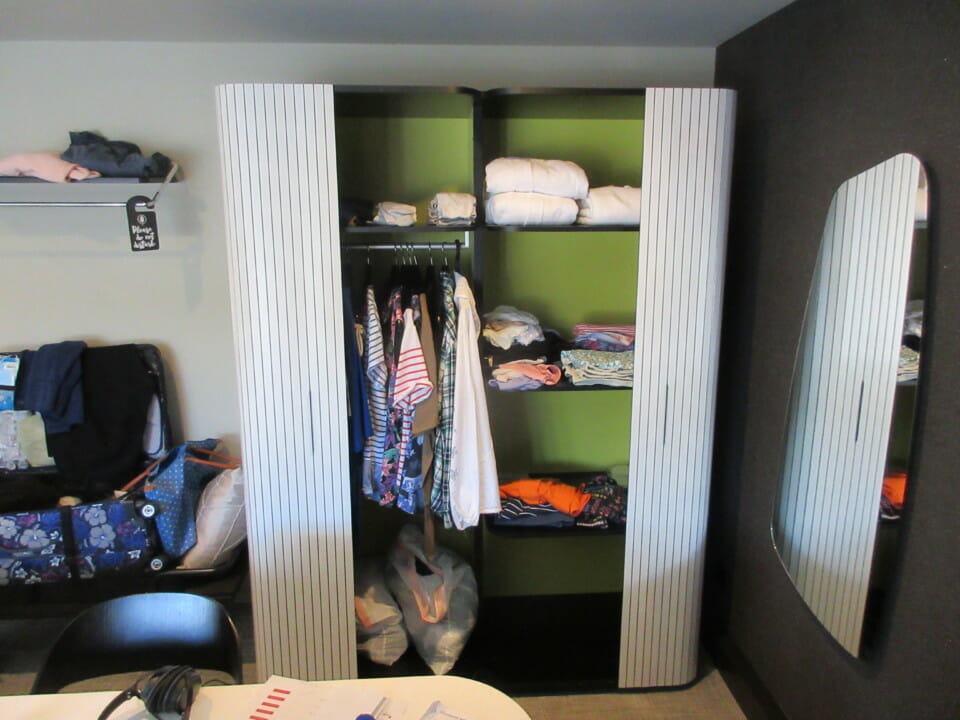 a closet with clothes on it