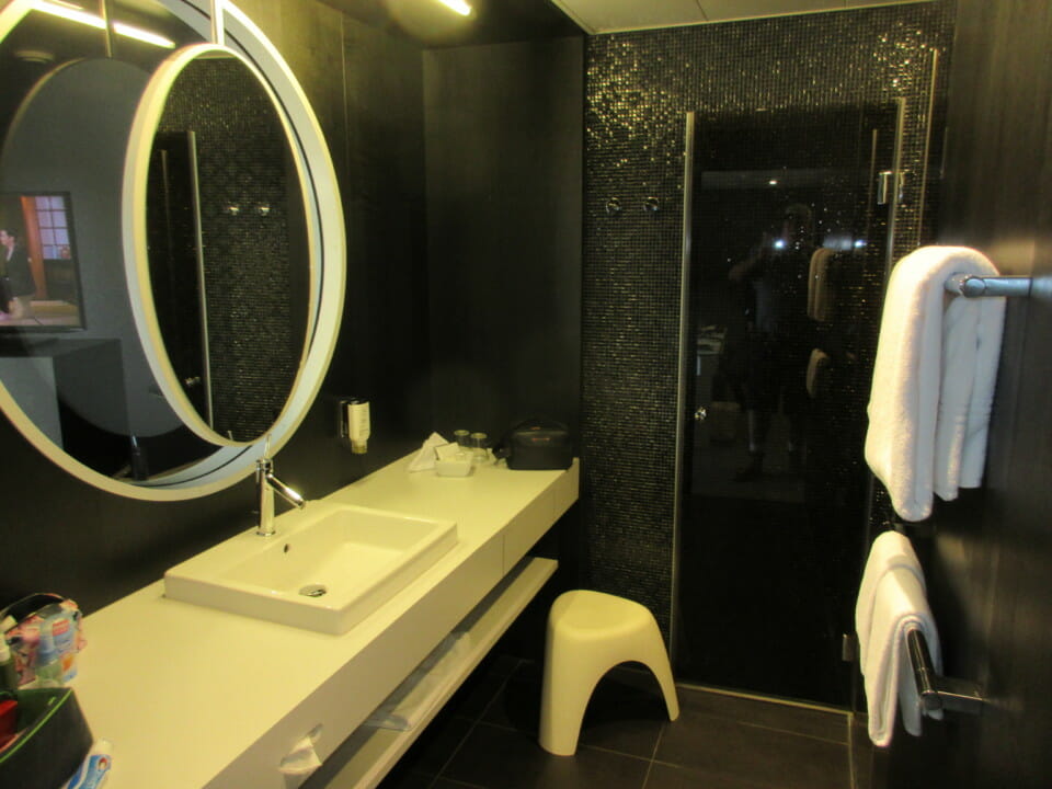 a bathroom with a mirror and sink