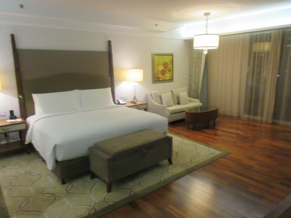 a bedroom with a bed and a couch