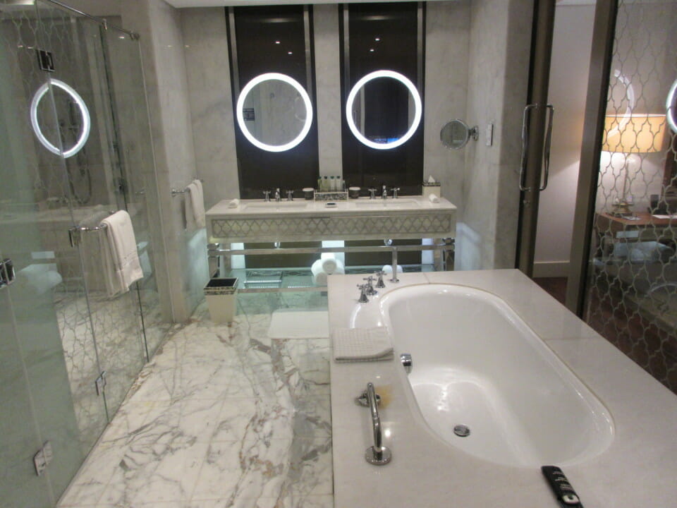 a bathroom with a large tub and a sink