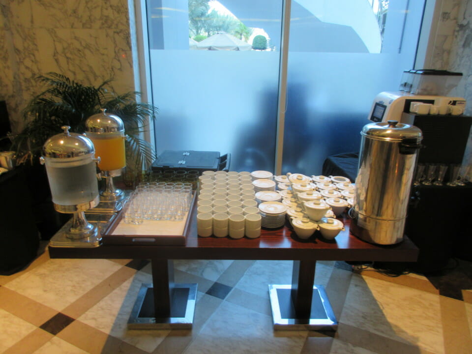 a table with a variety of cups and glasses