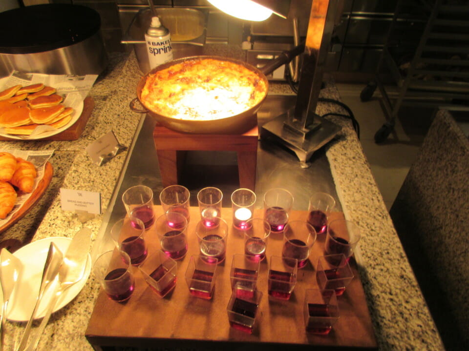 a tray of food and glasses on a table