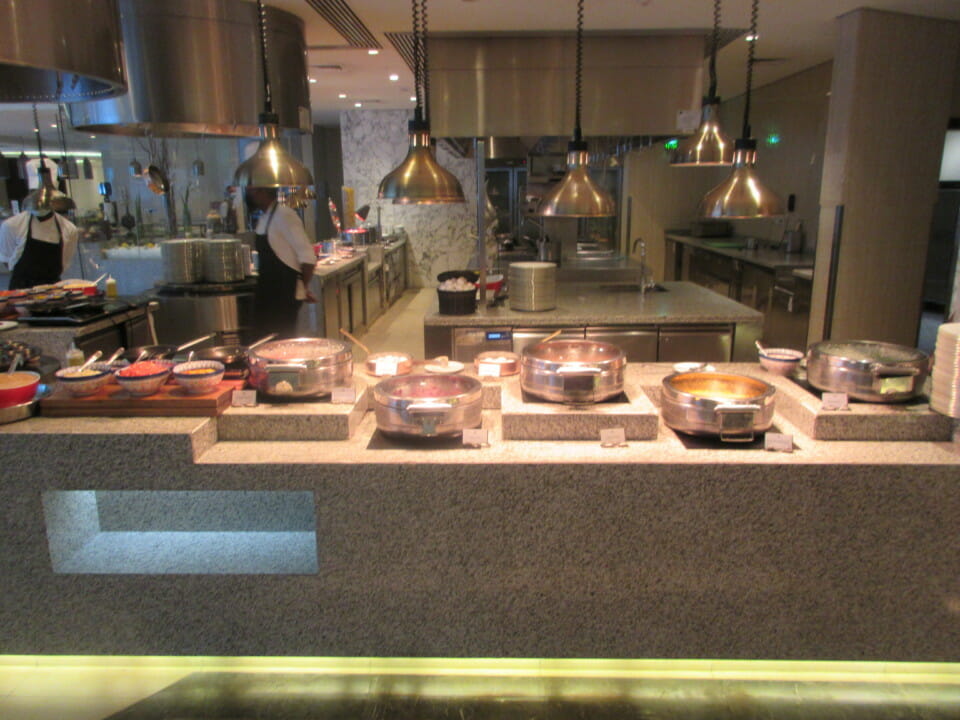 a kitchen with many pots and pans