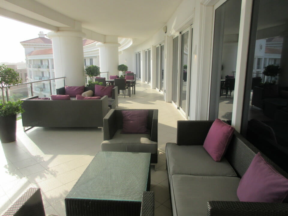 a patio with couches and chairs