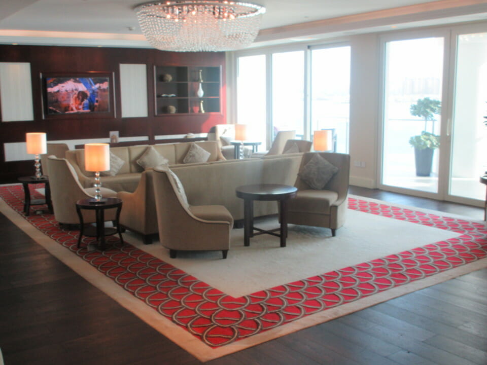 a room with a couch and a chandelier