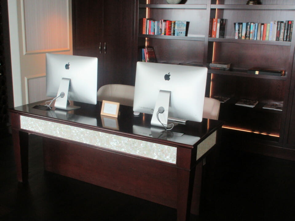 a desk with computers on it