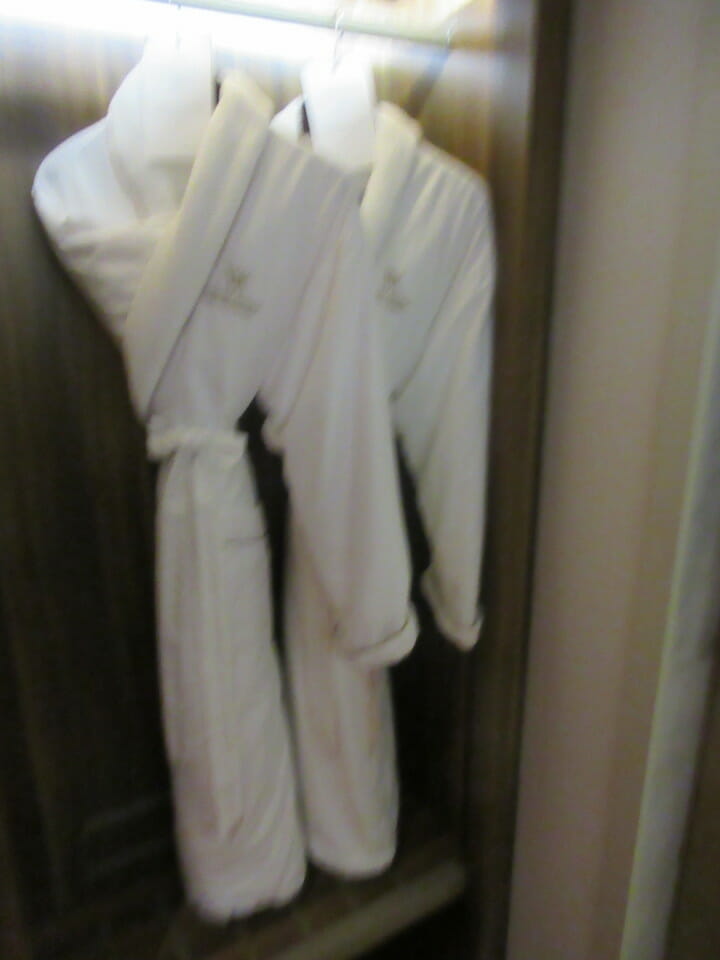 a white robe on a swinger