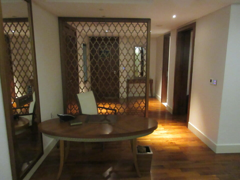 a room with a table and a mirror