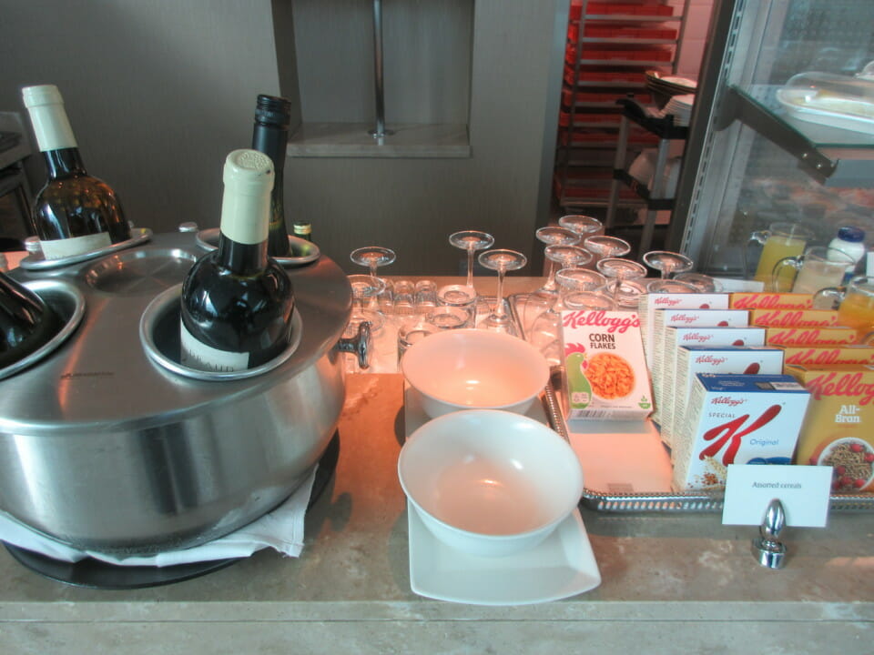 a table with wine bottles and bowls