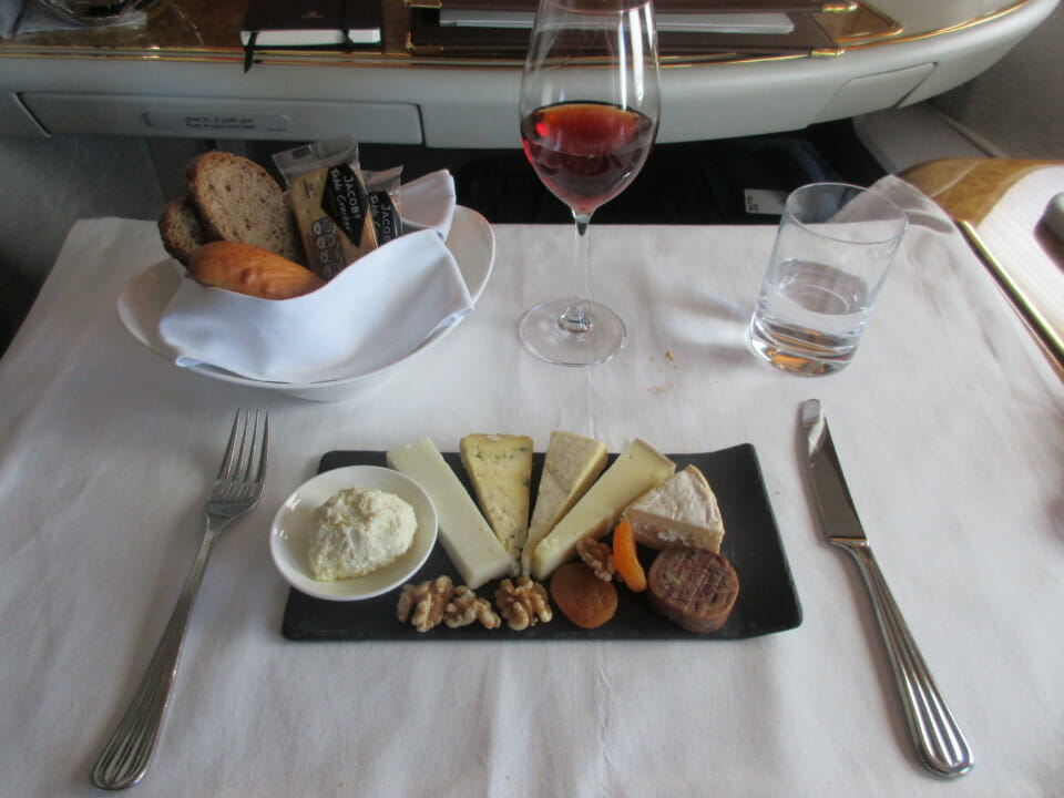 a plate of food and a glass of wine