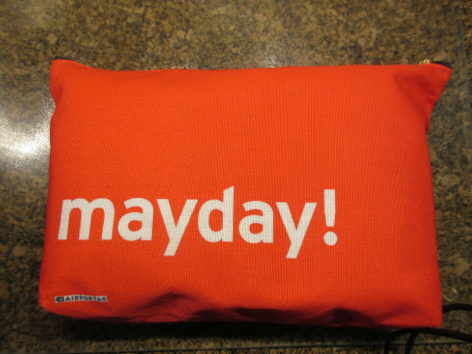 a red pillow with white text on it