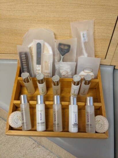 a wooden box with a variety of toiletries