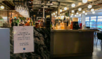 a bar with bottles of alcohol