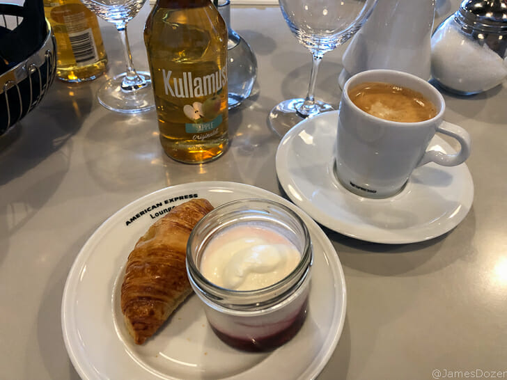 a plate of food and a cup of coffee