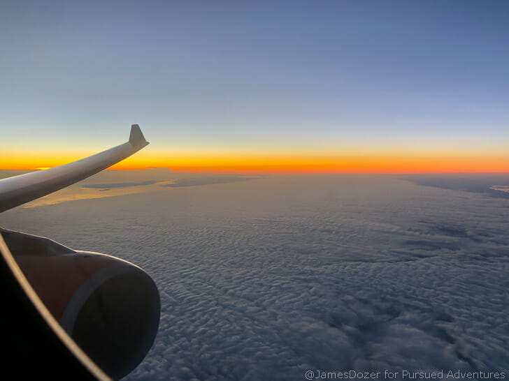 an airplane wing and clouds