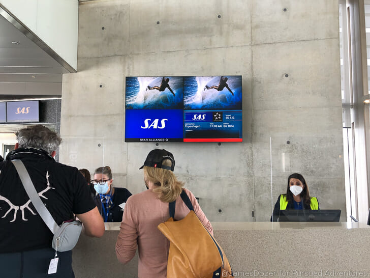 people standing in front of a screen