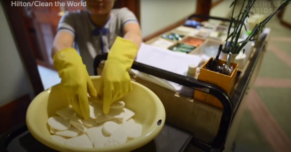 a person wearing gloves and cleaning gloves