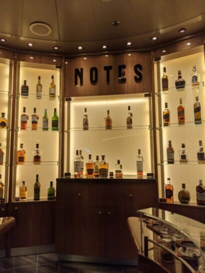 a room with a display of liquor bottles