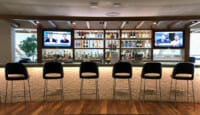 a row of chairs in a bar