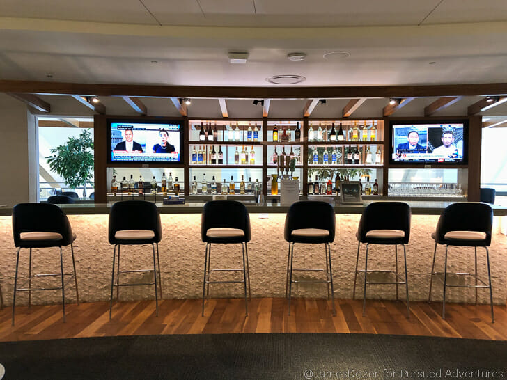 a row of chairs in a bar
