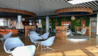a room with chairs and a wall of plants