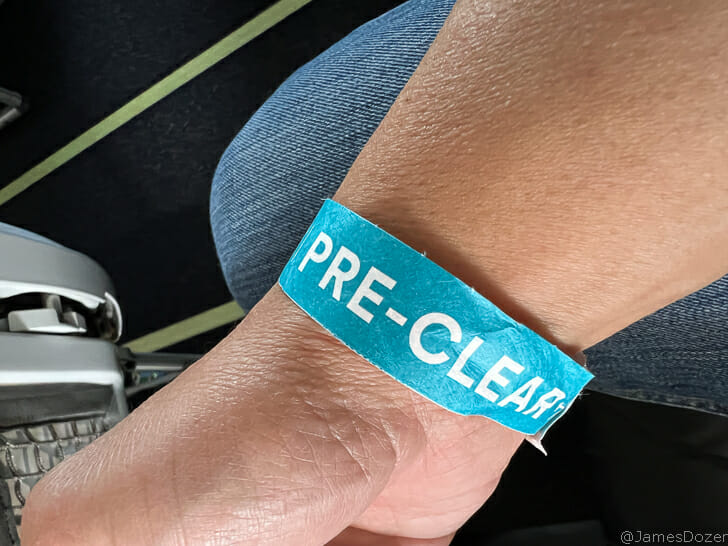 a wrist with a blue band on it