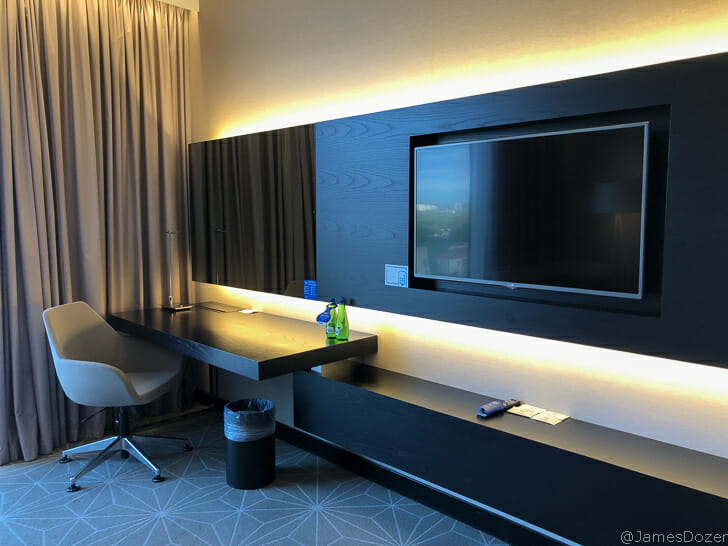 a room with a tv and a table
