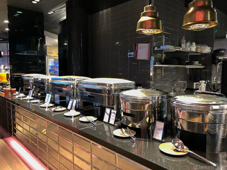 a row of silver containers on a counter