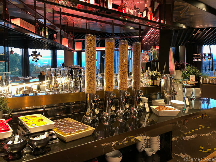 a bar with many tall glass containers