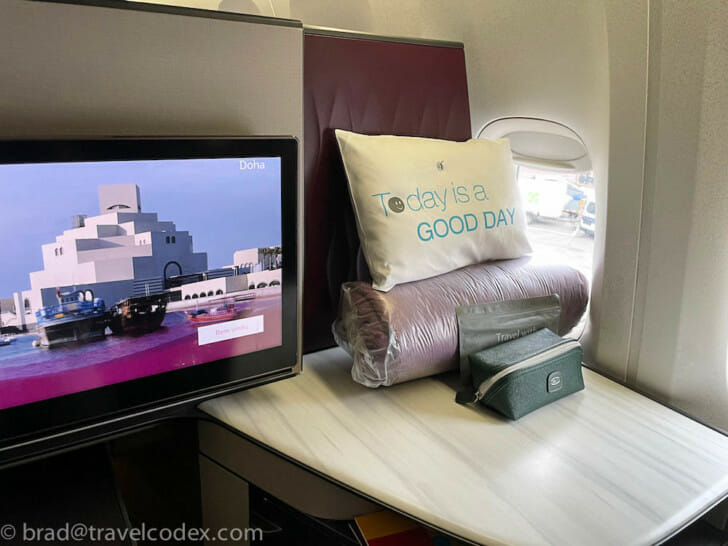 a screen and a pillow on a table
