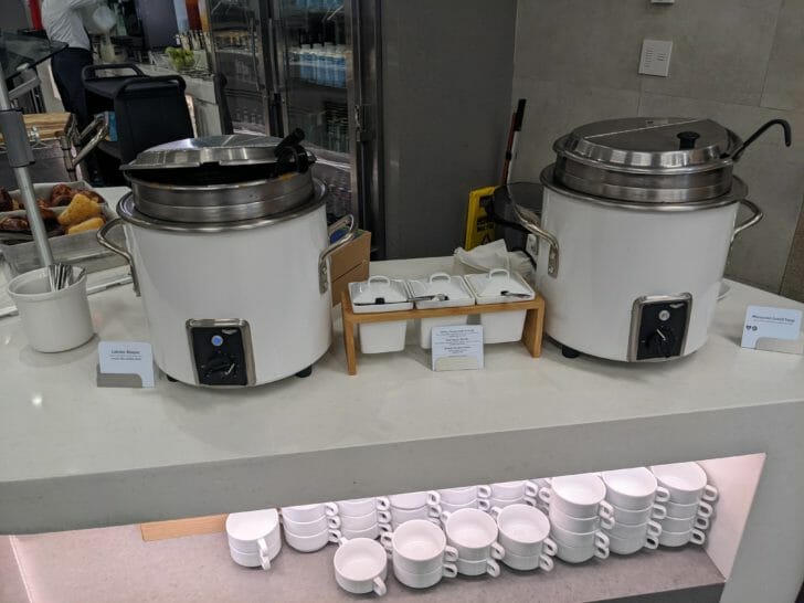 a group of large white pots on a counter