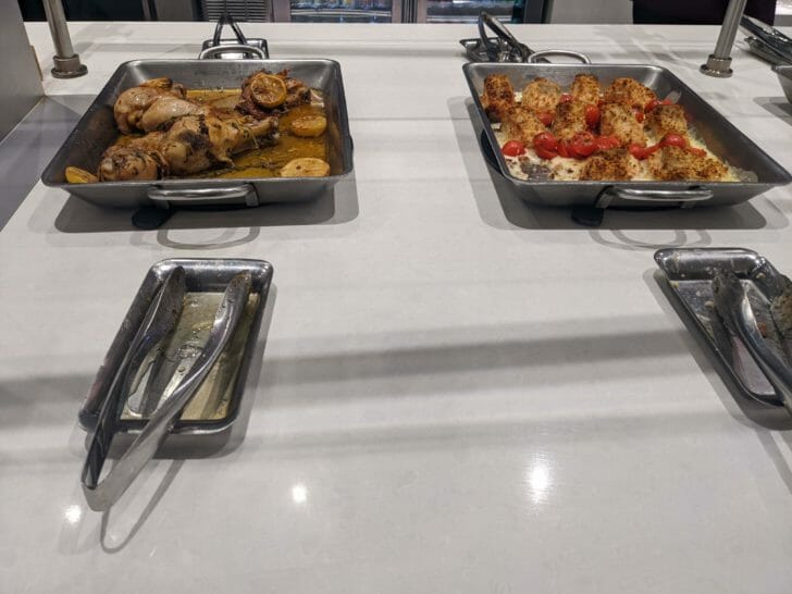 a group of trays of food on a table