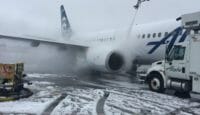 a jet plane with snow on the ground