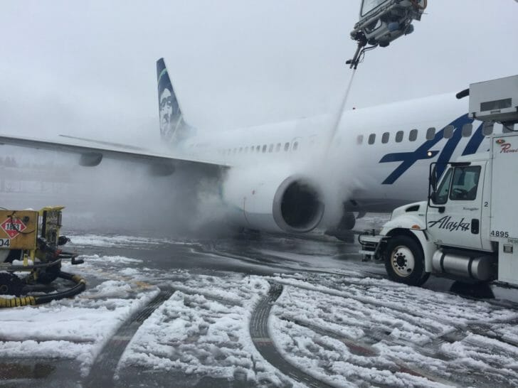 a jet plane with snow on the ground