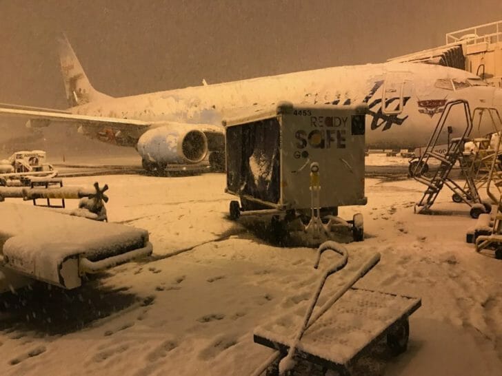 a plane parked in the snow