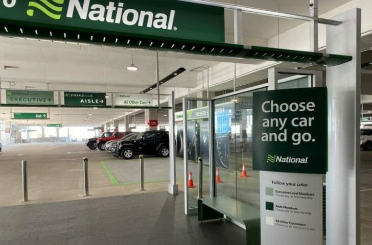 a car parking lot with a sign