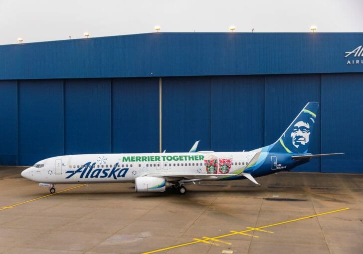 a plane parked in front of a building