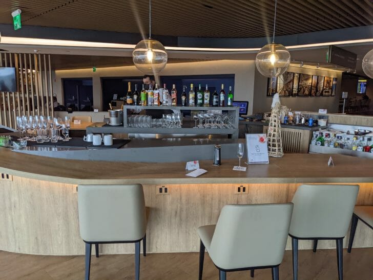 a bar with glasses and bottles on it