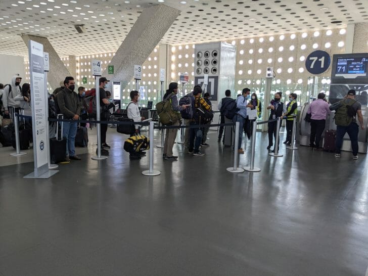 people standing in a line in a building