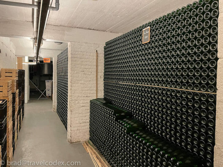 a large stack of wine bottles