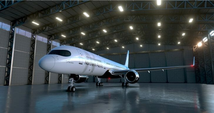 a white airplane in a hangar